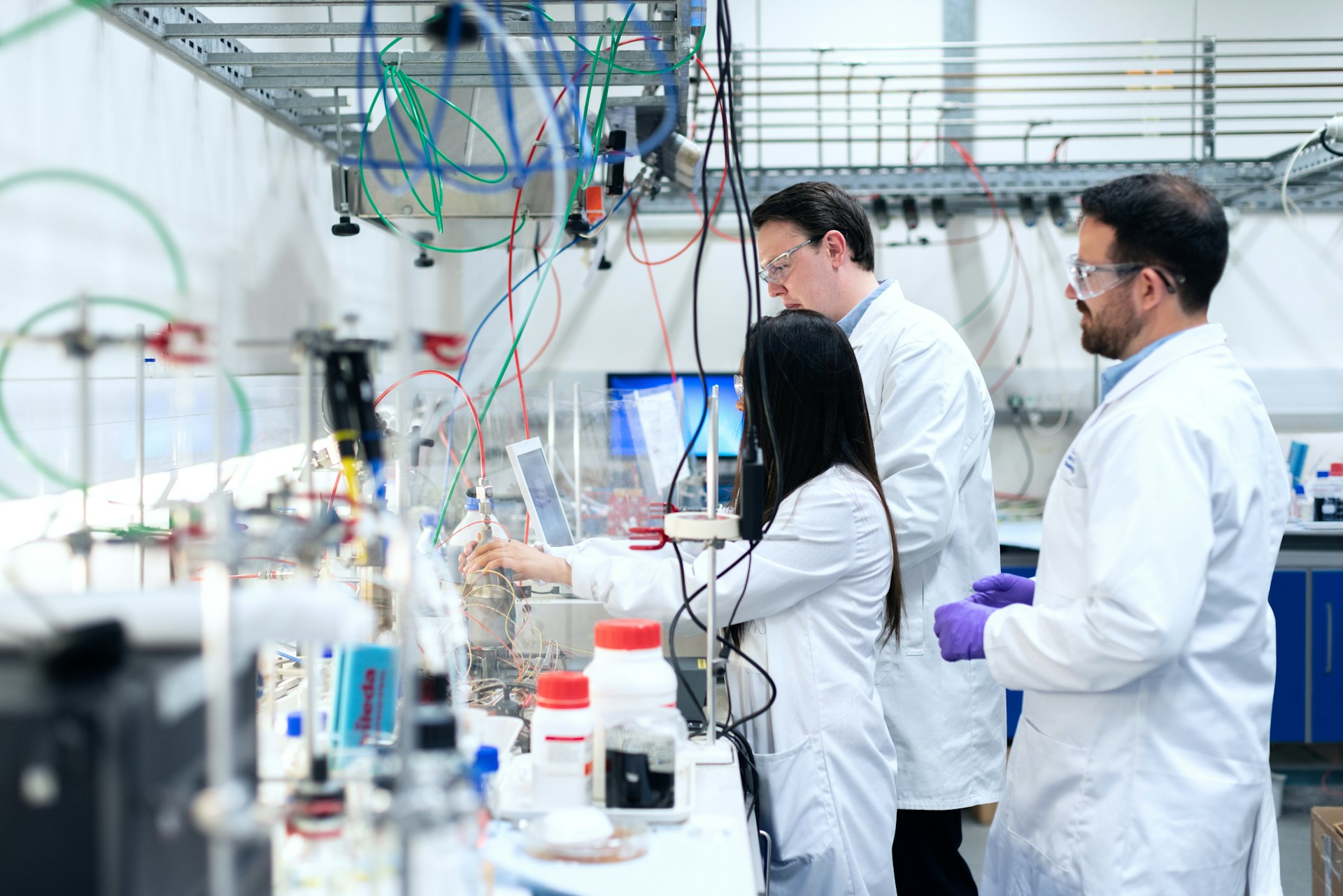 Researchers working in a modern biotech laboratory